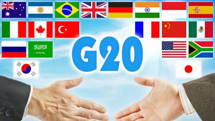 G20 - flagi państw i uścisk dłoni