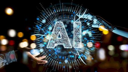 sztuczna inteligencja, napis AI, ręka człowieka i ręka robota w geście tworzenia