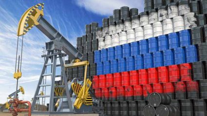Beczki z ropa i flagą Rosji